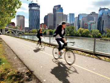 Cyclists riding on Calgary's urban pathway system.