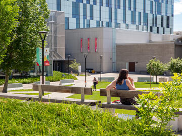 Student enjoying the outdoor space on main campus.