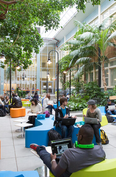 Students studying in the atrium.