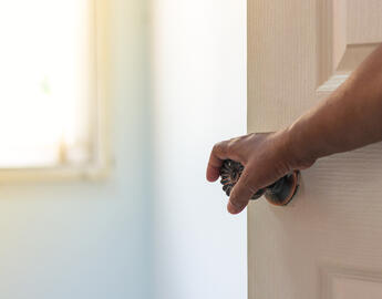 Person opening door.